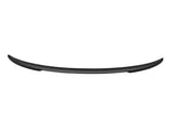 A curved, black plastic spoiler designed for vehicle aerodynamics, centrally positioned against a plain, white background.