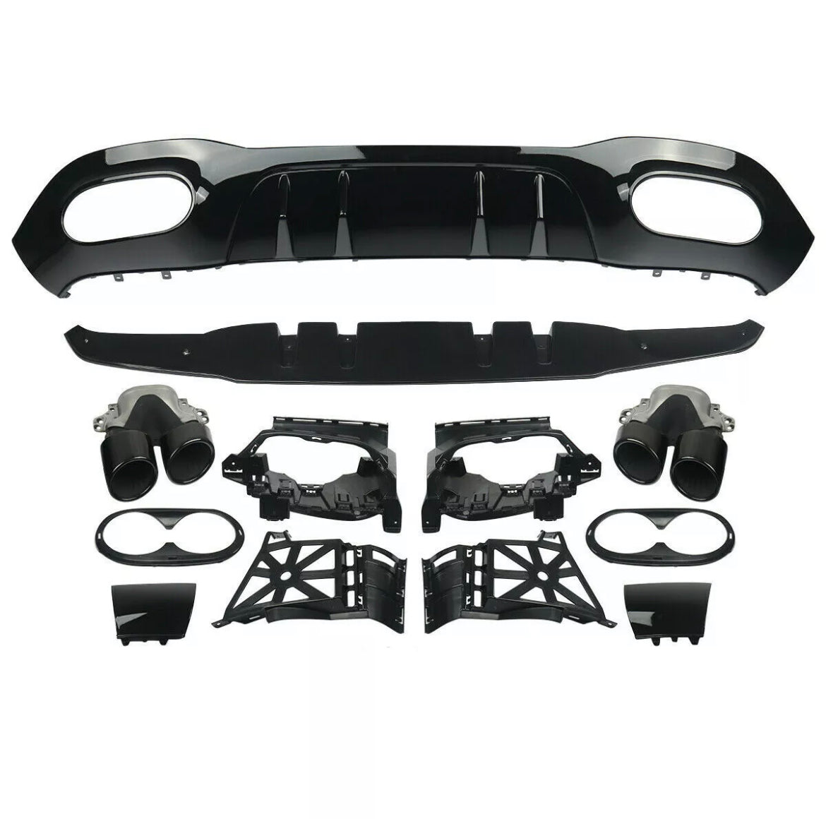 Car parts are laid out for assembly, including a black bumper diffuser, exhaust tips, and various mounting brackets. The components are organized neatly on a plain white background.