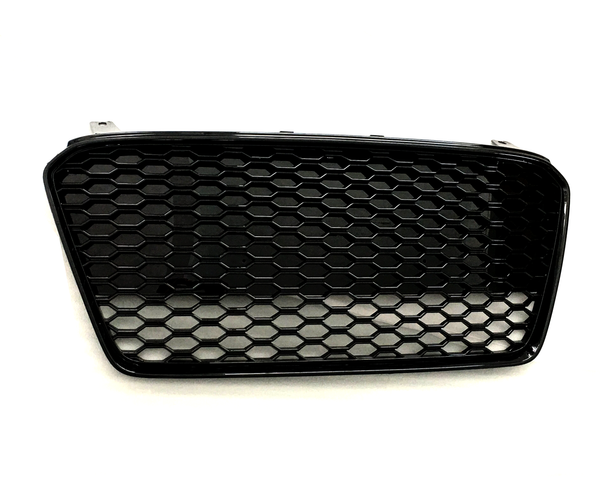 A black honeycomb-patterned car grille lies flat against a plain white background, showcasing its hexagonal mesh design and curved rectangular shape.