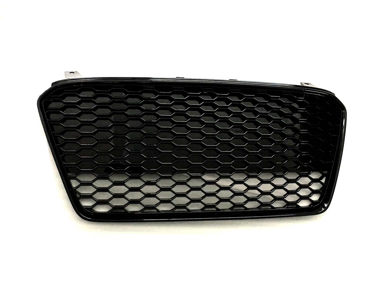 A black honeycomb-patterned car grille lies flat against a plain white background, showcasing its hexagonal mesh design and curved rectangular shape.